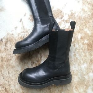 Black leather LUG boots in the style of Bottega Veneta